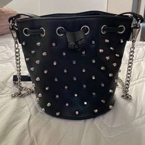 Black crossbody studded bag.